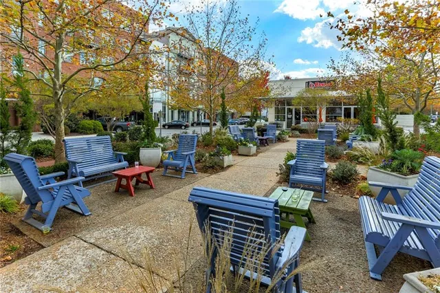 a view of a patio with table and chairs and potted plants