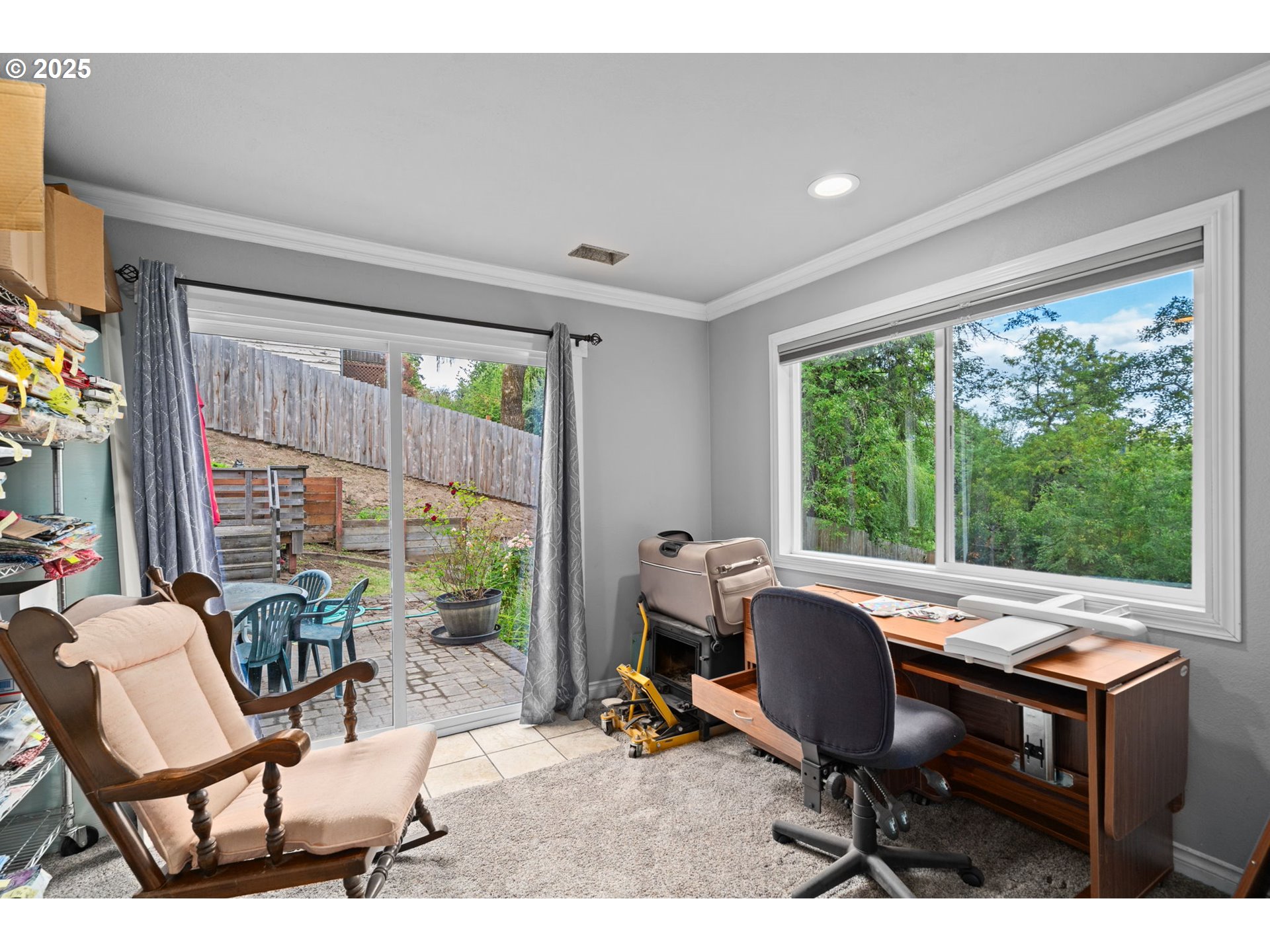 5944 Southwest Wilbard Street Portland, OR 97219 - Photo 12 of 21 a view of a workspace with furniture and a window