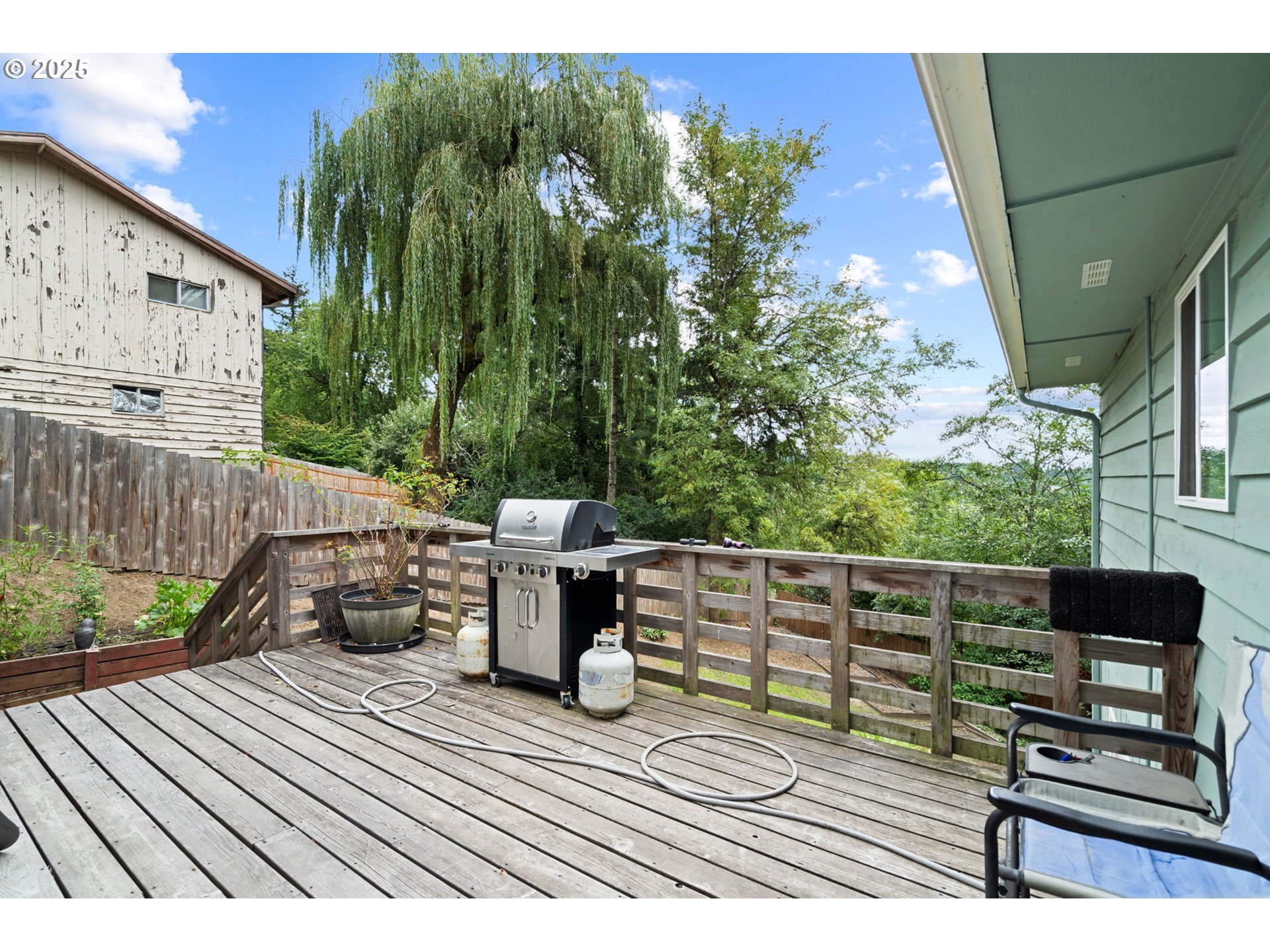 5944 Southwest Wilbard Street Portland, OR 97219 - Photo 16 of 21 a view of deck with table and chairs and wooden floor