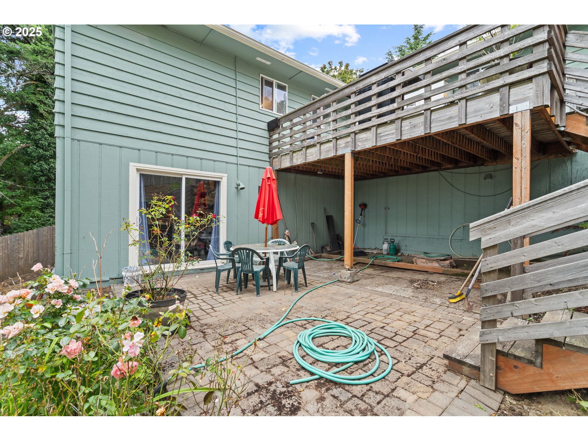 5944 Southwest Wilbard Street Portland, OR 97219 - Photo 17 of 21 a view of a patio with table and chairs and potted plants
