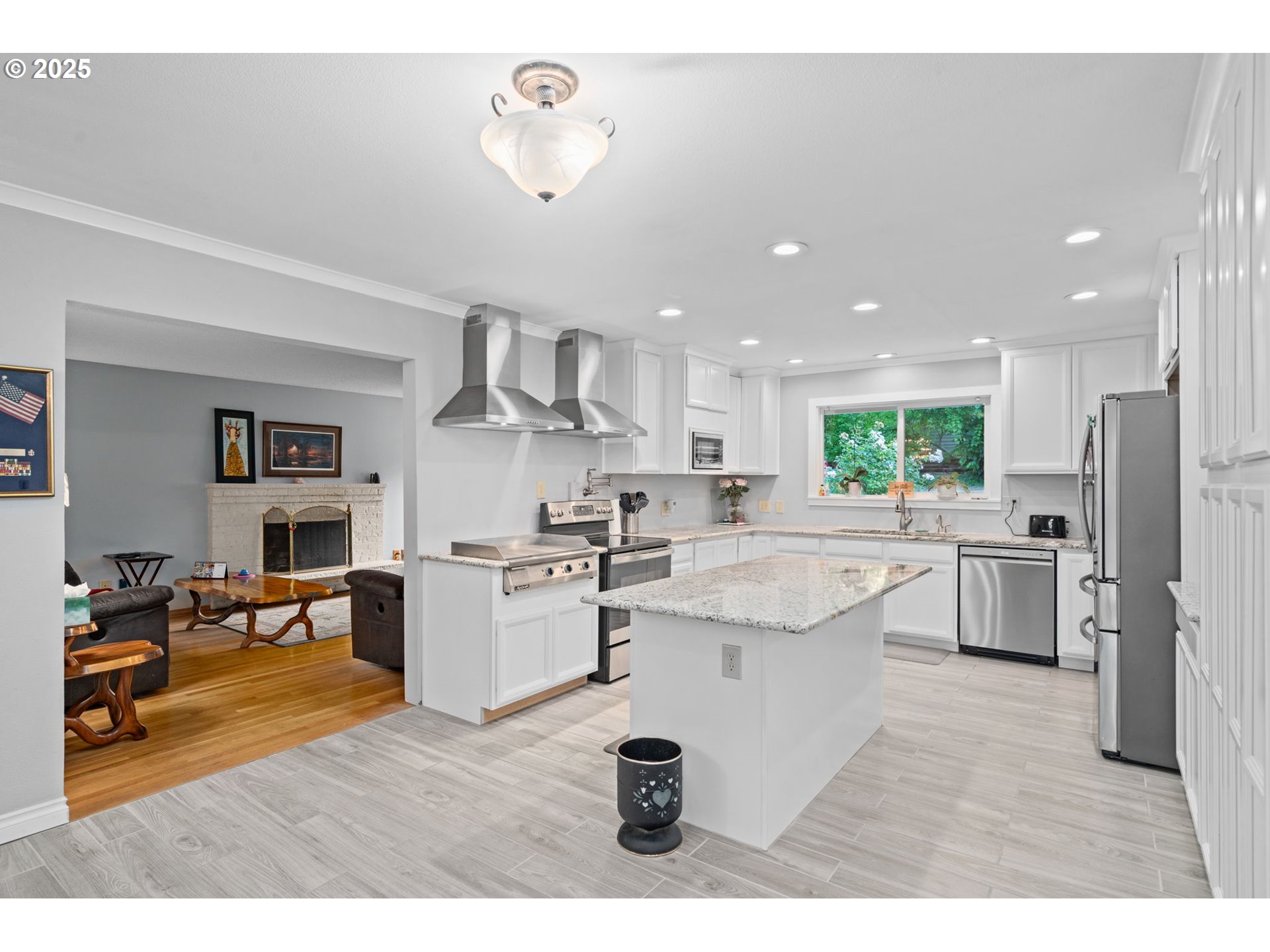 5944 Southwest Wilbard Street Portland, OR 97219 - Photo 5 of 21 a open kitchen with cabinets a sink and appliances