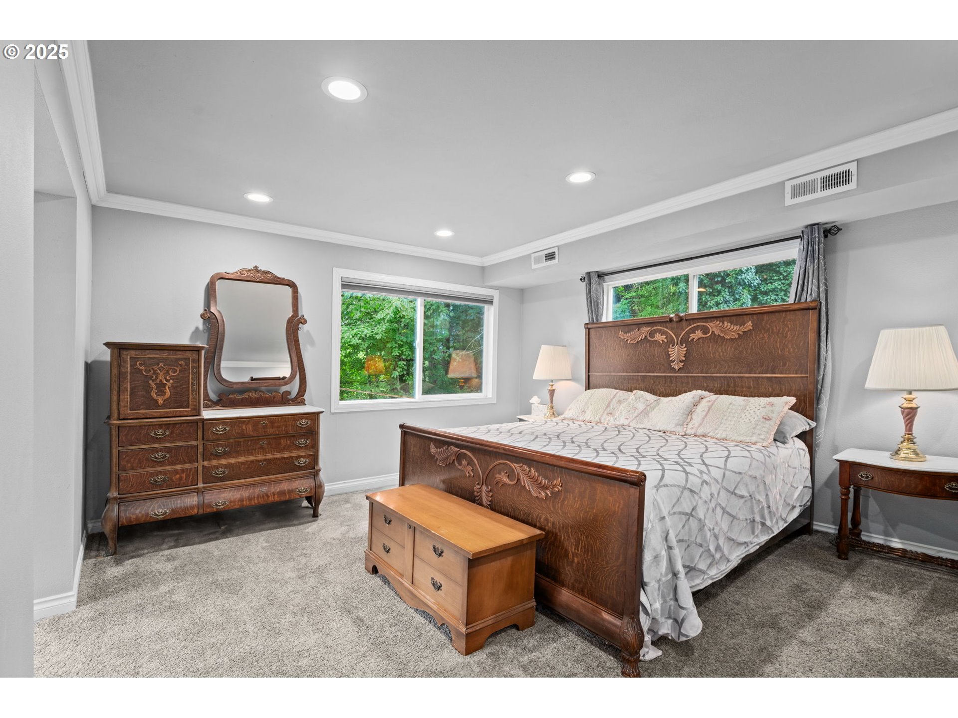 5944 Southwest Wilbard Street Portland, OR 97219 - Photo 6 of 21 a bed room with a bed and a window