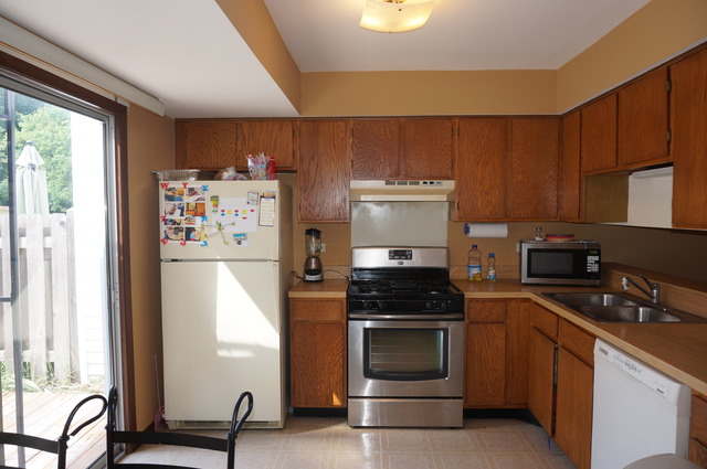 1315 Inverness Drive, Unit 1315 Elgin, IL 60120 - Photo 5 of 16 a kitchen with stainless steel appliances a refrigerator stove and sink