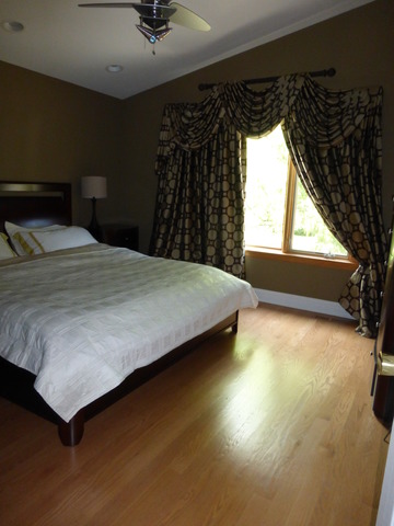 2928 Covert Road Glenview, IL 60025 - Photo 14 of 23 a bed sitting in a bedroom next to a window