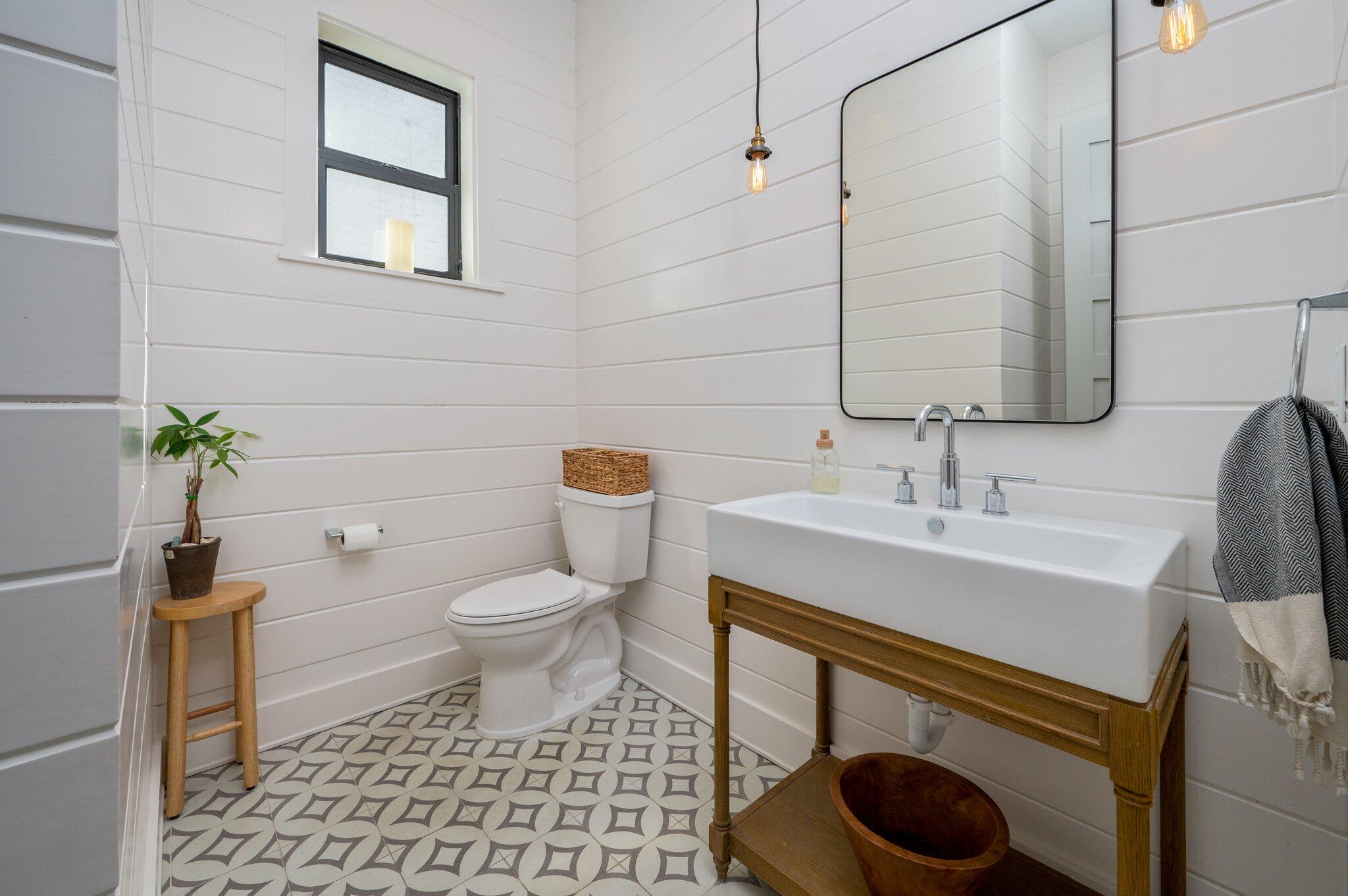 164 Bay Trace Santa Rosa Beach, FL 32459 - Photo 53 of 90 a bathroom with a sink toilet and a mirror