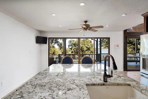 a view of a kitchen with a large window