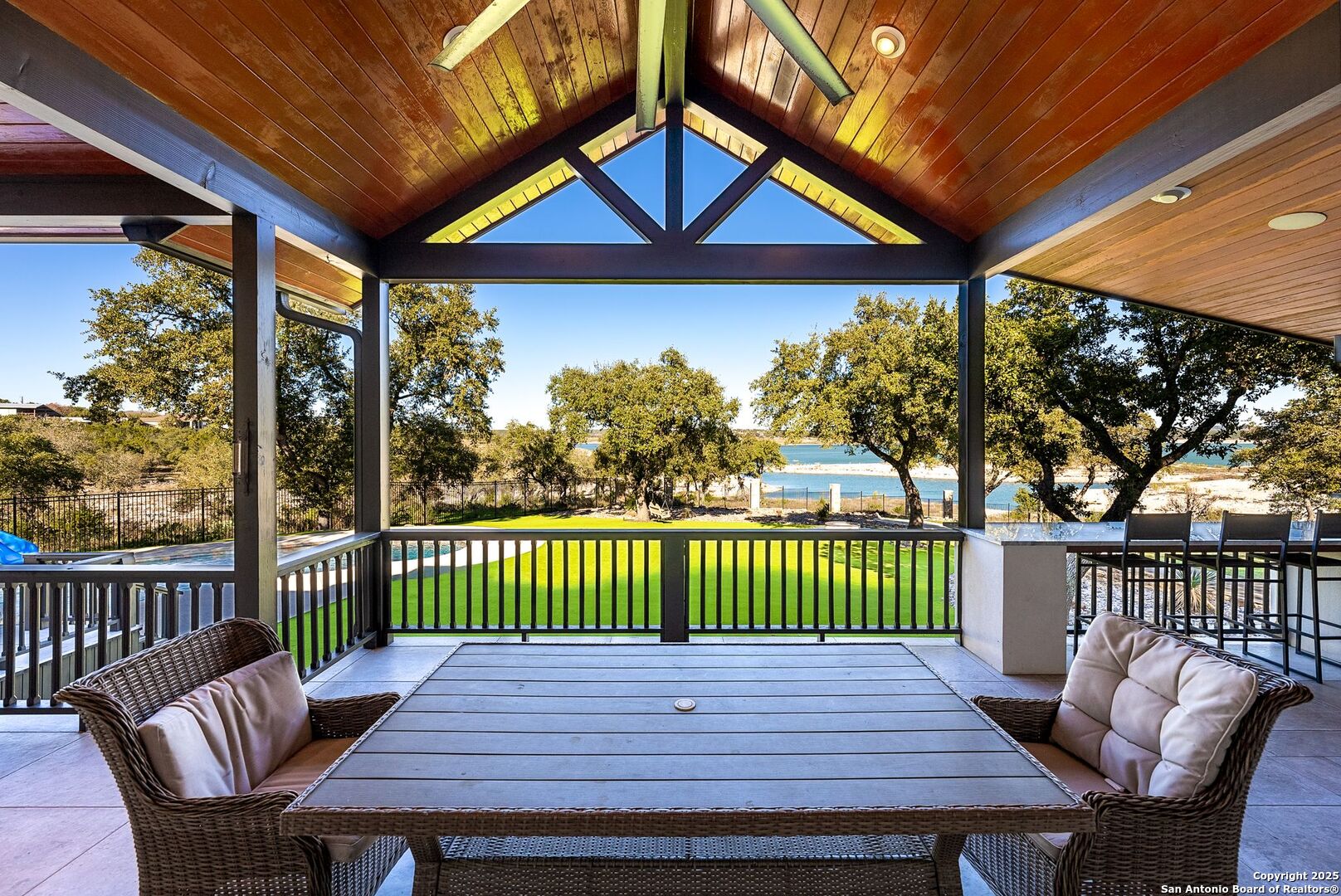 1240 Rip Jay Circle Canyon Lake, TX 78133 - Photo 2 of 52 a view of a chairs and table in the patio
