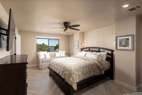 a bedroom with bed and a window