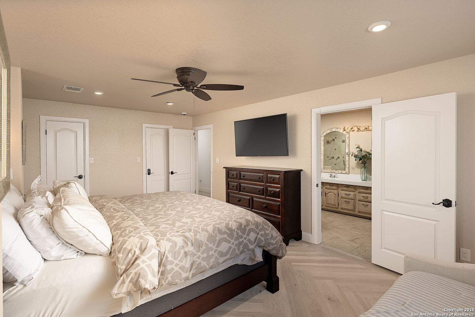 1240 Rip Jay Circle Canyon Lake, TX 78133 - Photo 23 of 52 a bedroom with a bed and a television