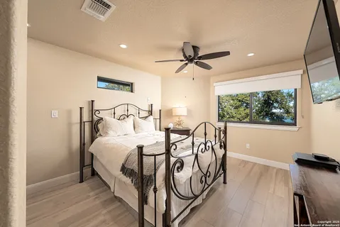 a bedroom with furniture and a window