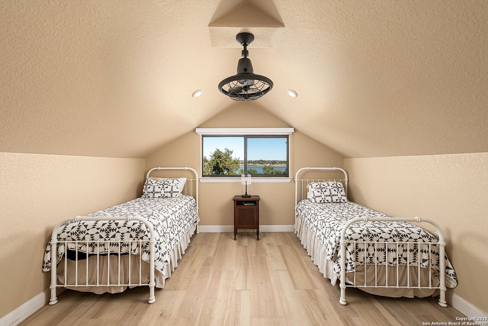 1240 Rip Jay Circle Canyon Lake, TX 78133 - Photo 29 of 52 a bedroom with a bed and window