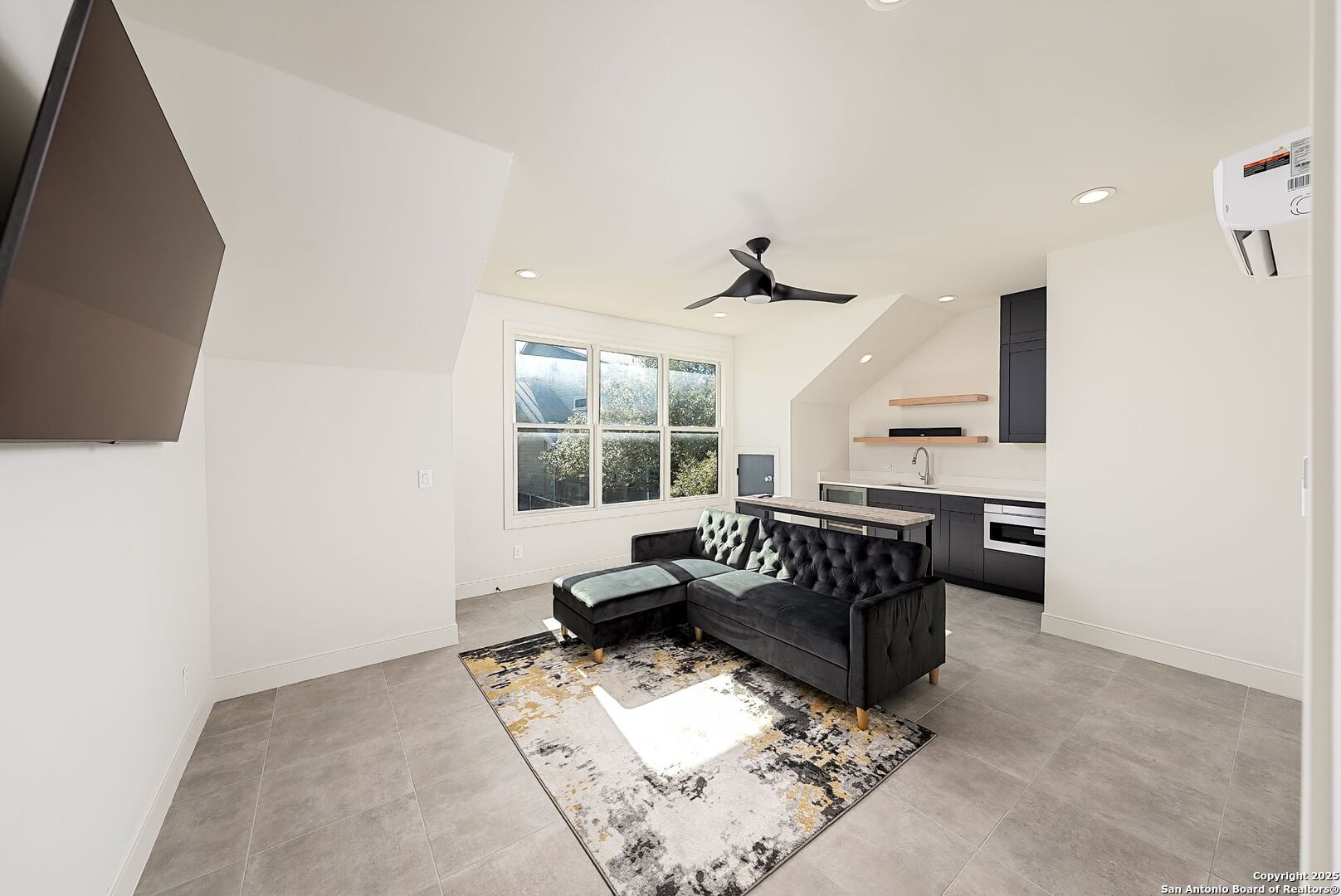 1240 Rip Jay Circle Canyon Lake, TX 78133 - Photo 30 of 52 a living room with furniture and a flat screen tv