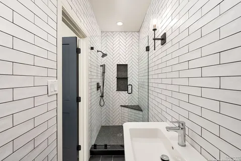 a bathroom with a sink and mirror