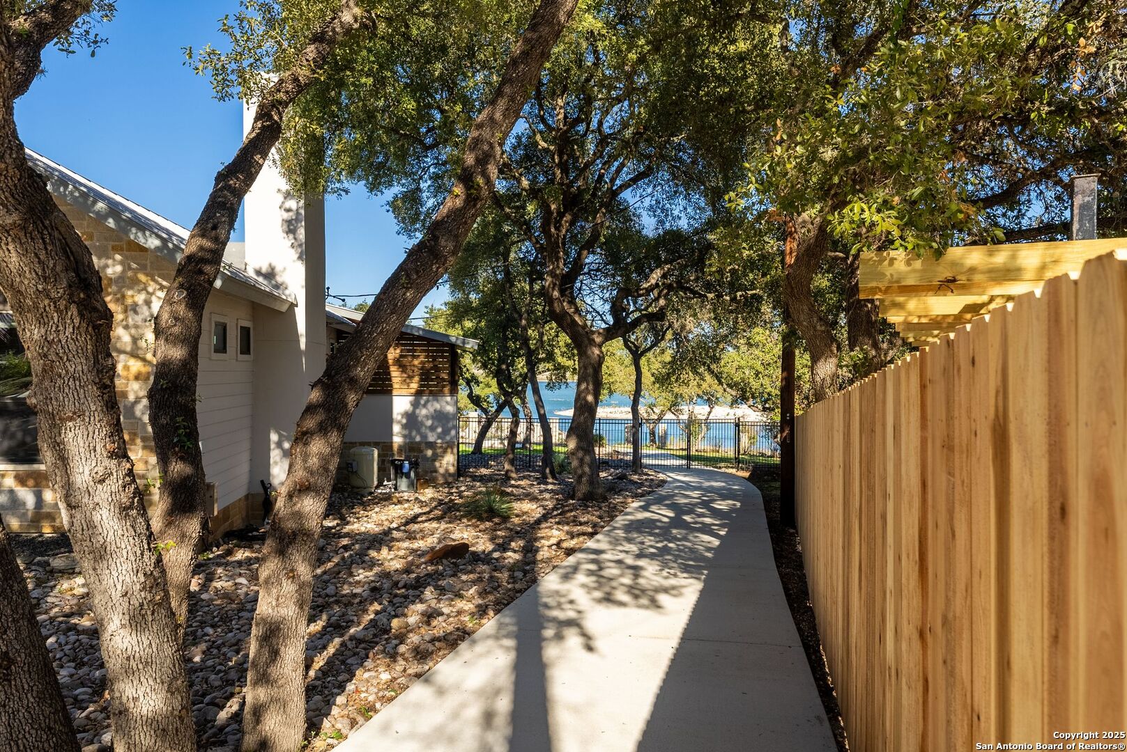 1240 Rip Jay Circle Canyon Lake, TX 78133 - Photo 34 of 52 a view of a backyard with wooden fence