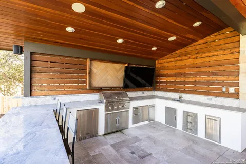 a kitchen with stainless steel appliances granite countertop a stove and a sink
