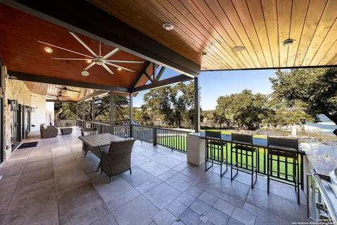 a view of a chairs and table in the patio