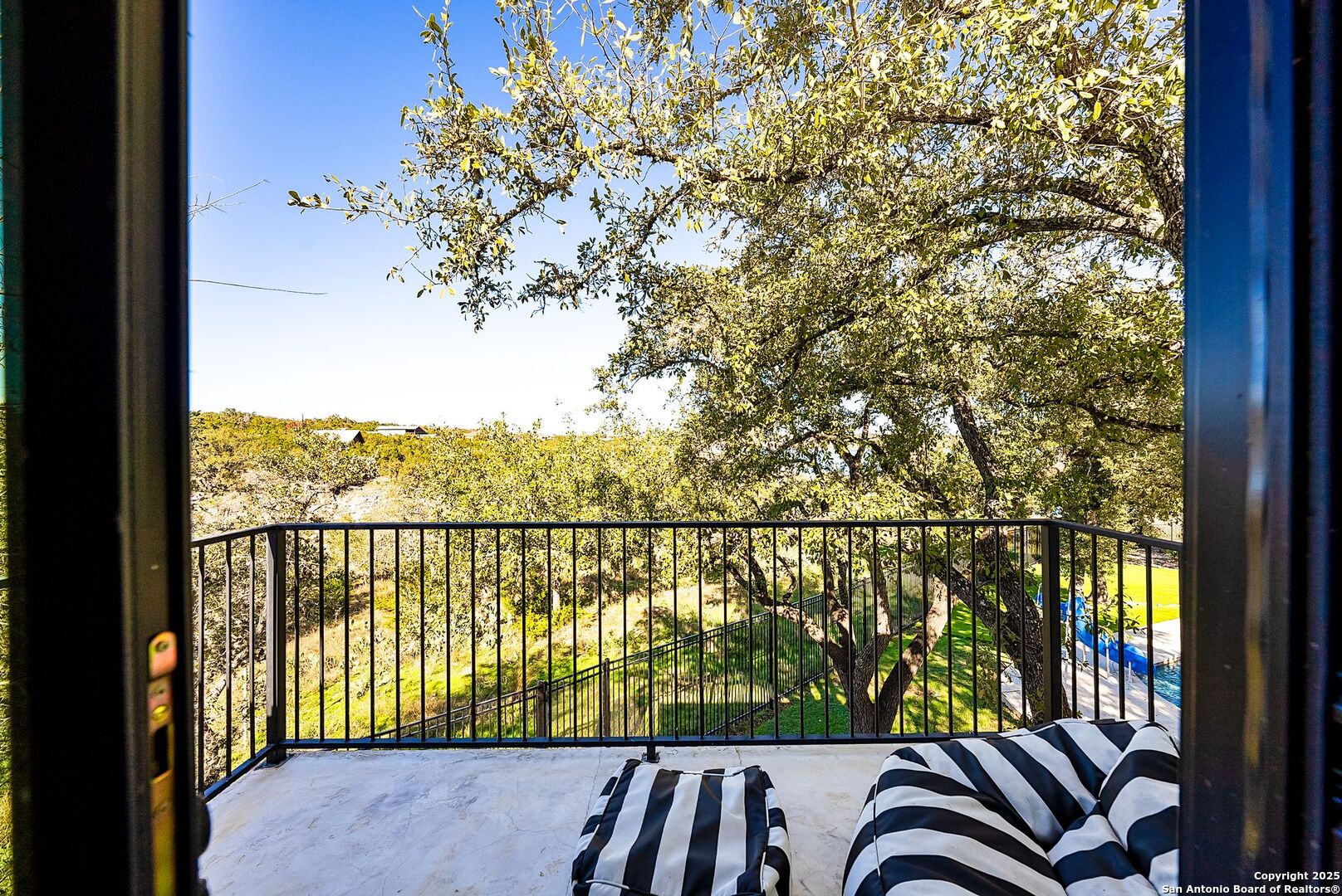 1240 Rip Jay Circle Canyon Lake, TX 78133 - Photo 51 of 52 a view of a balcony with a swing