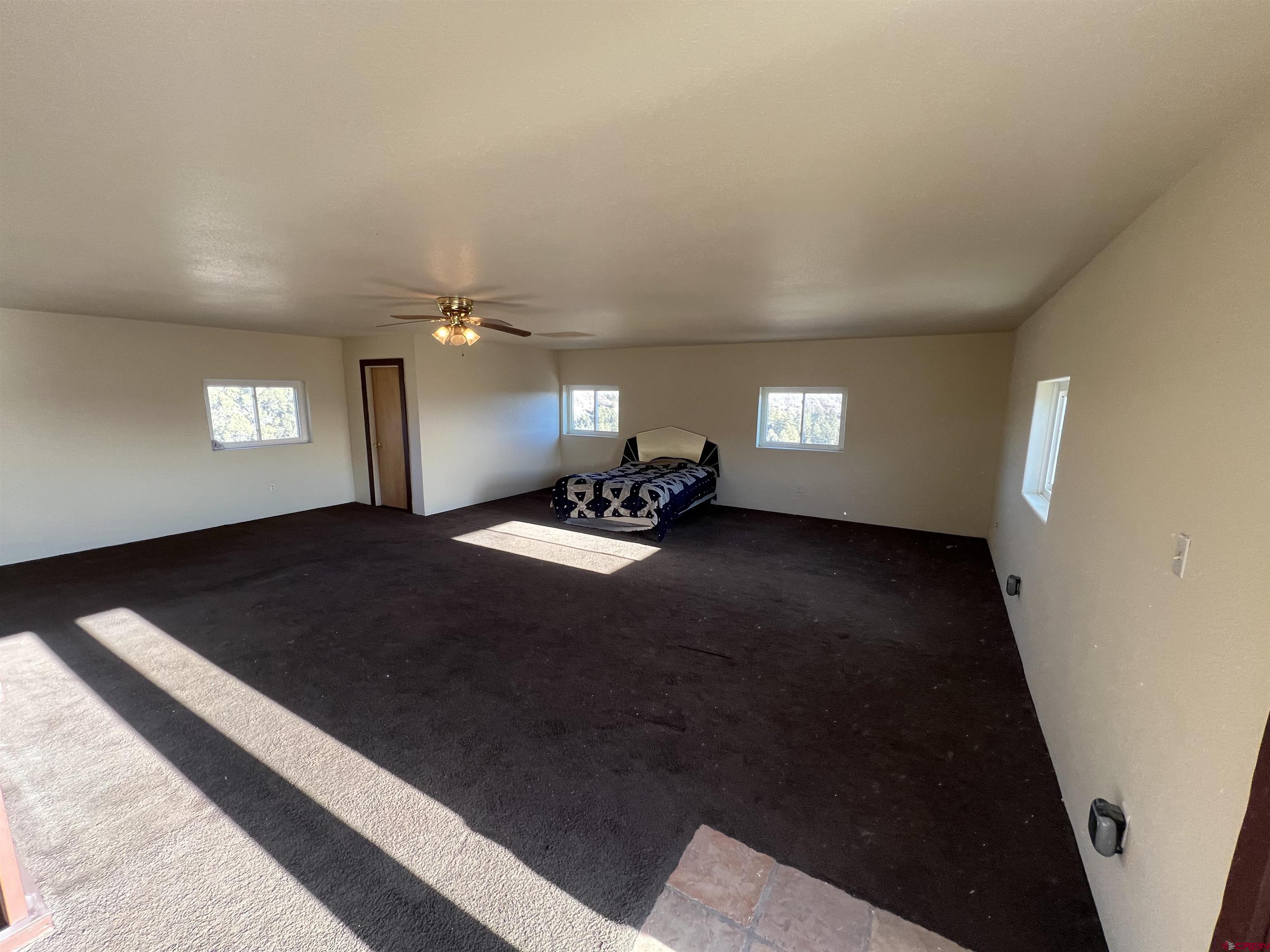 1350 Lion Road Durango, CO 81303 - Photo 30 of 31 a view of wooden floor and windows in an empty room