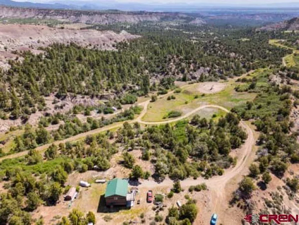 a view of a city with mountains in the background