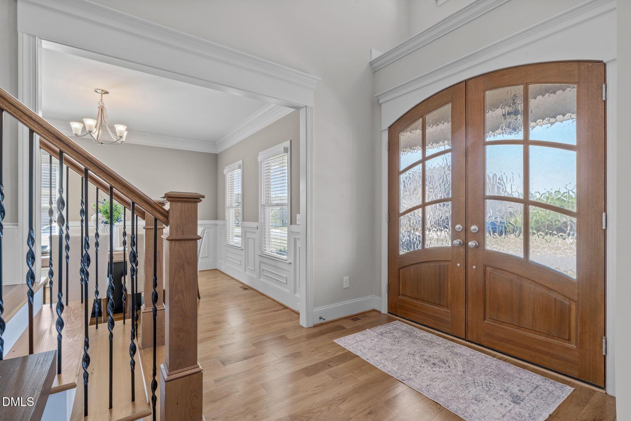 261 Character Drive Rolesville, NC 27571 - Photo 10 of 61 a view of entryway with stairs and wooden floor