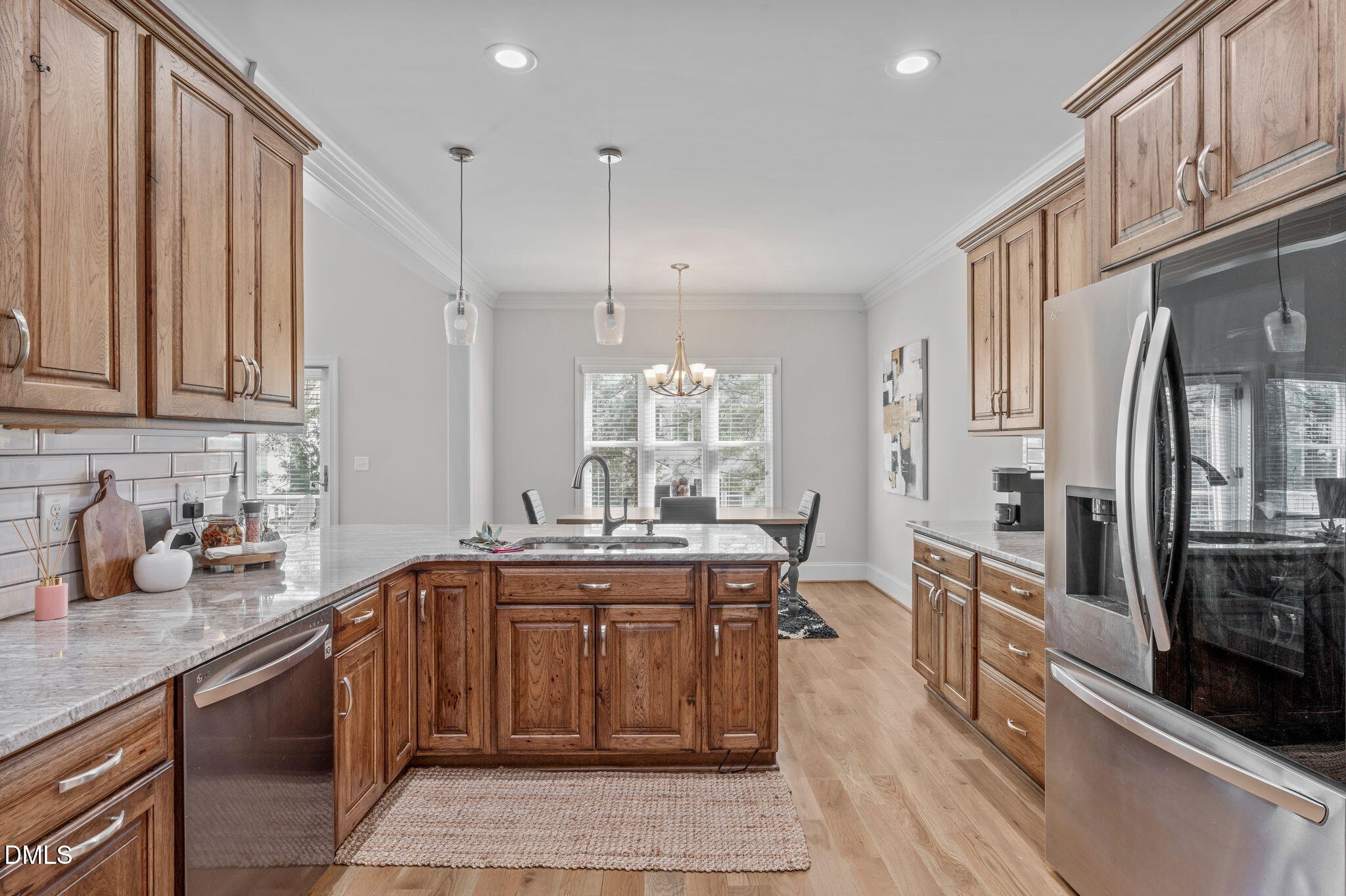 261 Character Drive Rolesville, NC 27571 - Photo 19 of 61 a kitchen with stainless steel appliances granite countertop a sink stove and refrigerator