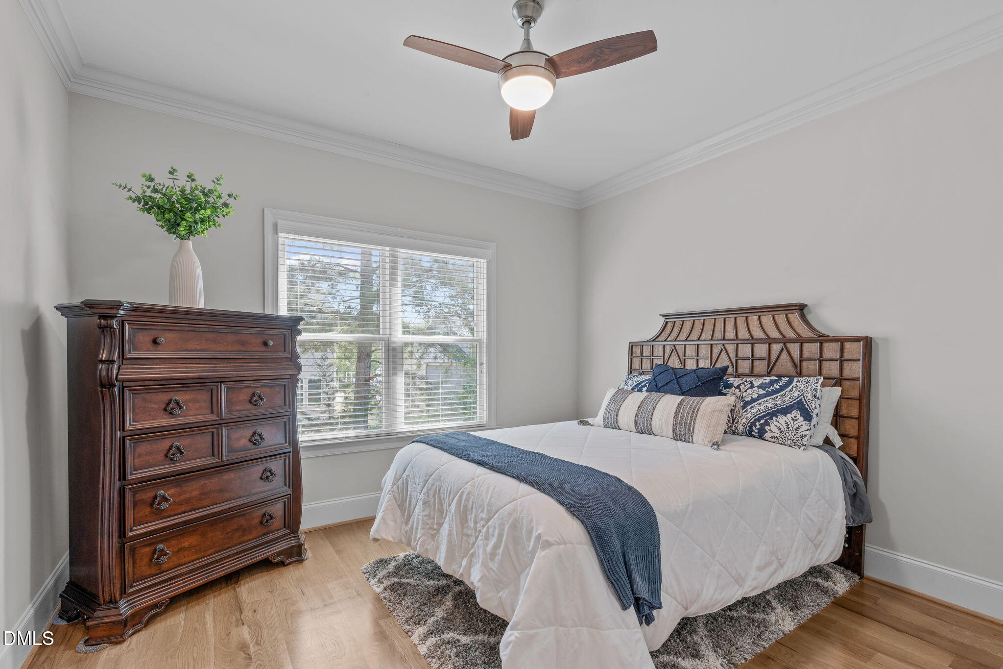 261 Character Drive Rolesville, NC 27571 - Photo 27 of 61 a bedroom with a bed and a dresser