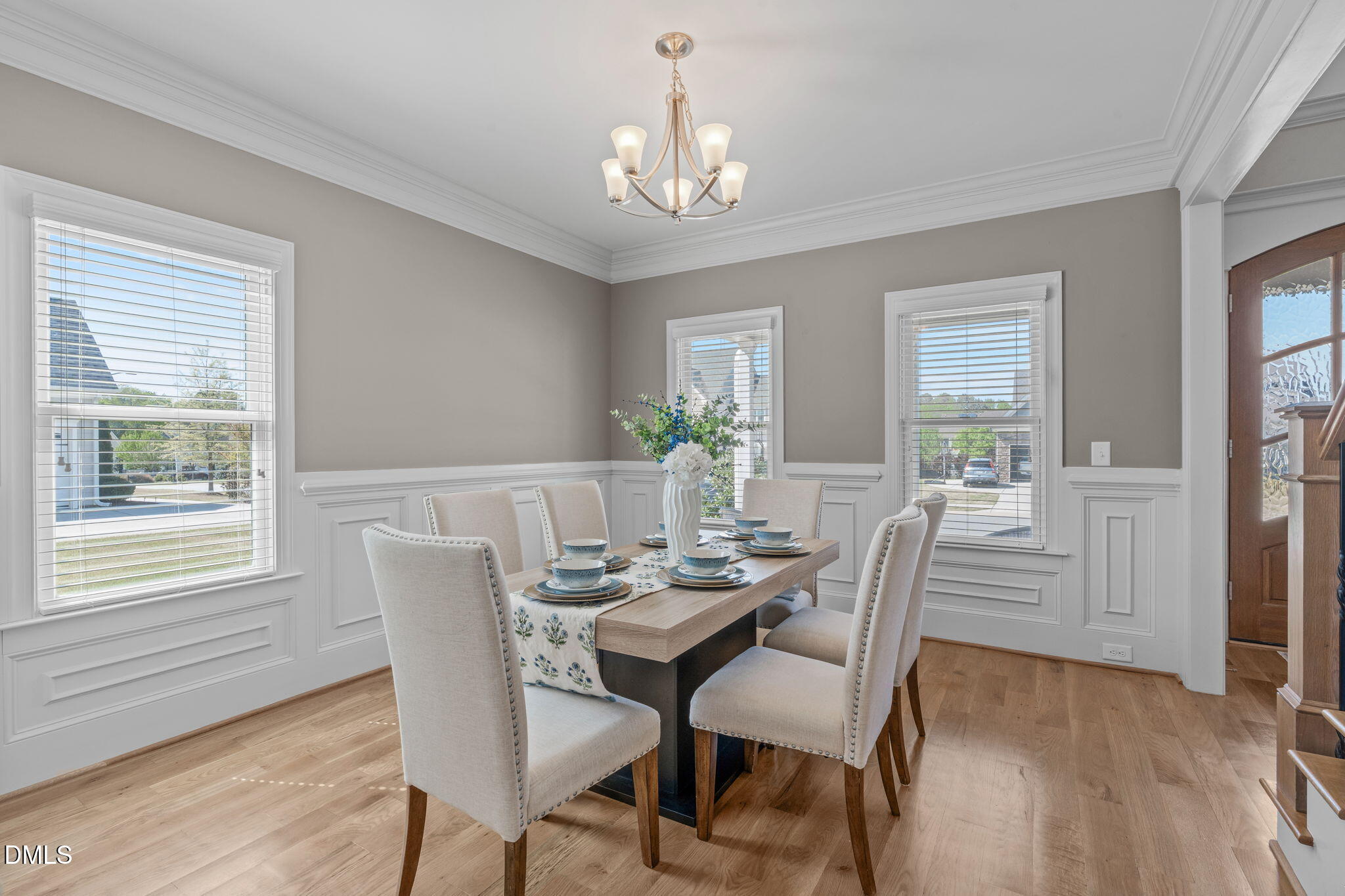 261 Character Drive Rolesville, NC 27571 - Photo 2 of 61 a dining room with furniture a chandelier and wooden floor