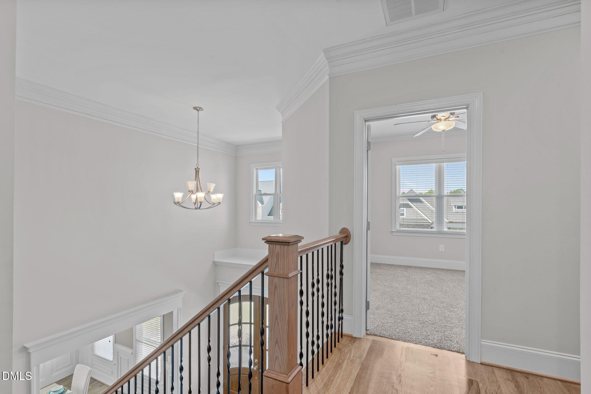 261 Character Drive Rolesville, NC 27571 - Photo 30 of 61 a view of a hallway with wooden floor and staircase
