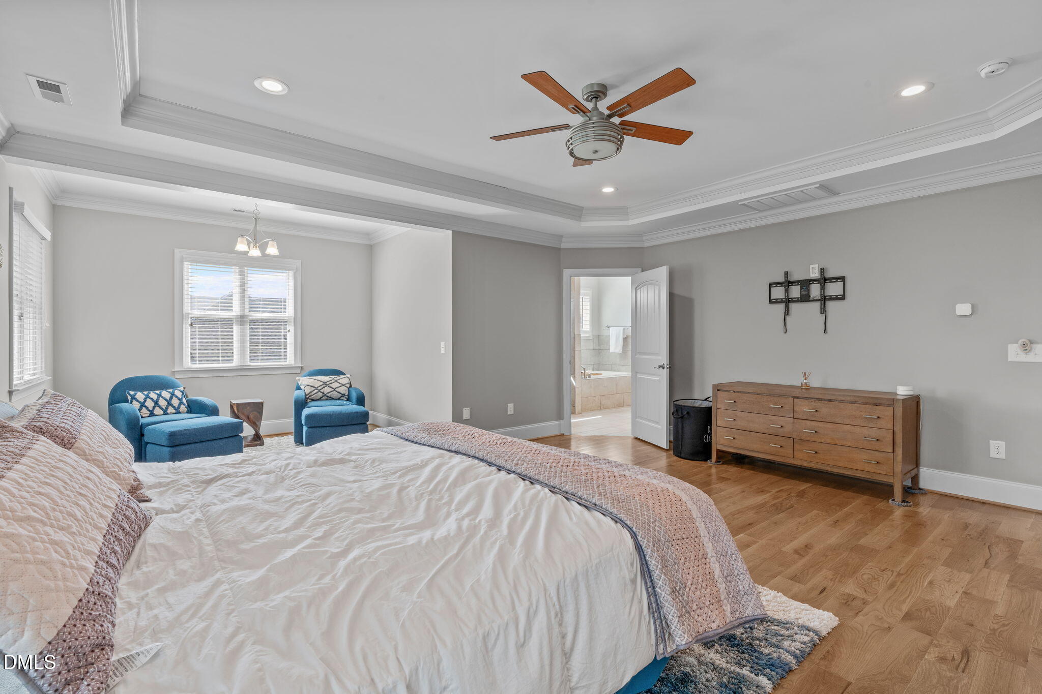 261 Character Drive Rolesville, NC 27571 - Photo 31 of 61 a bedroom with a bed a window and painting on the wall