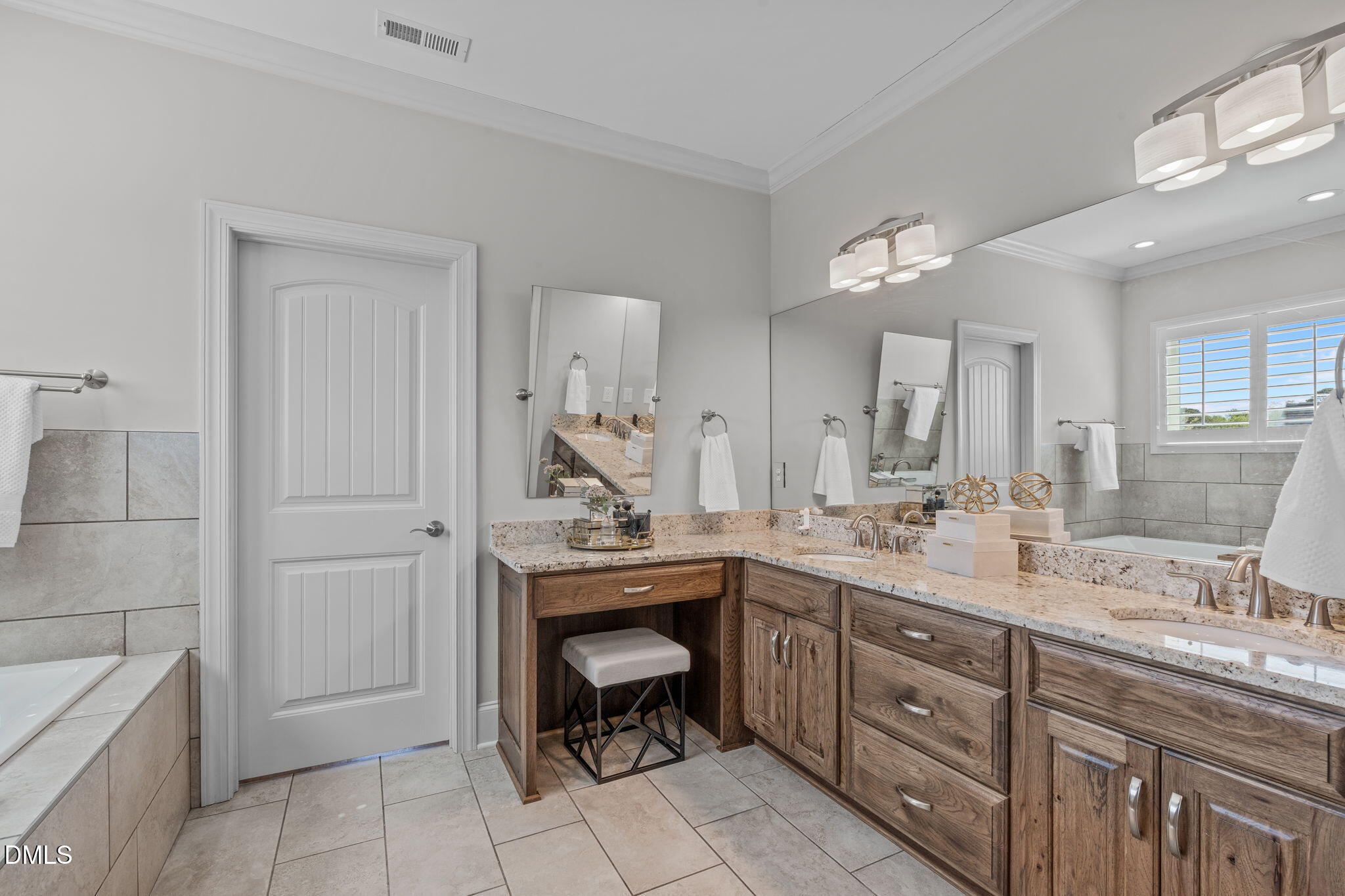261 Character Drive Rolesville, NC 27571 - Photo 38 of 61 a spacious bathroom with a granite countertop sink a toilet and mirror