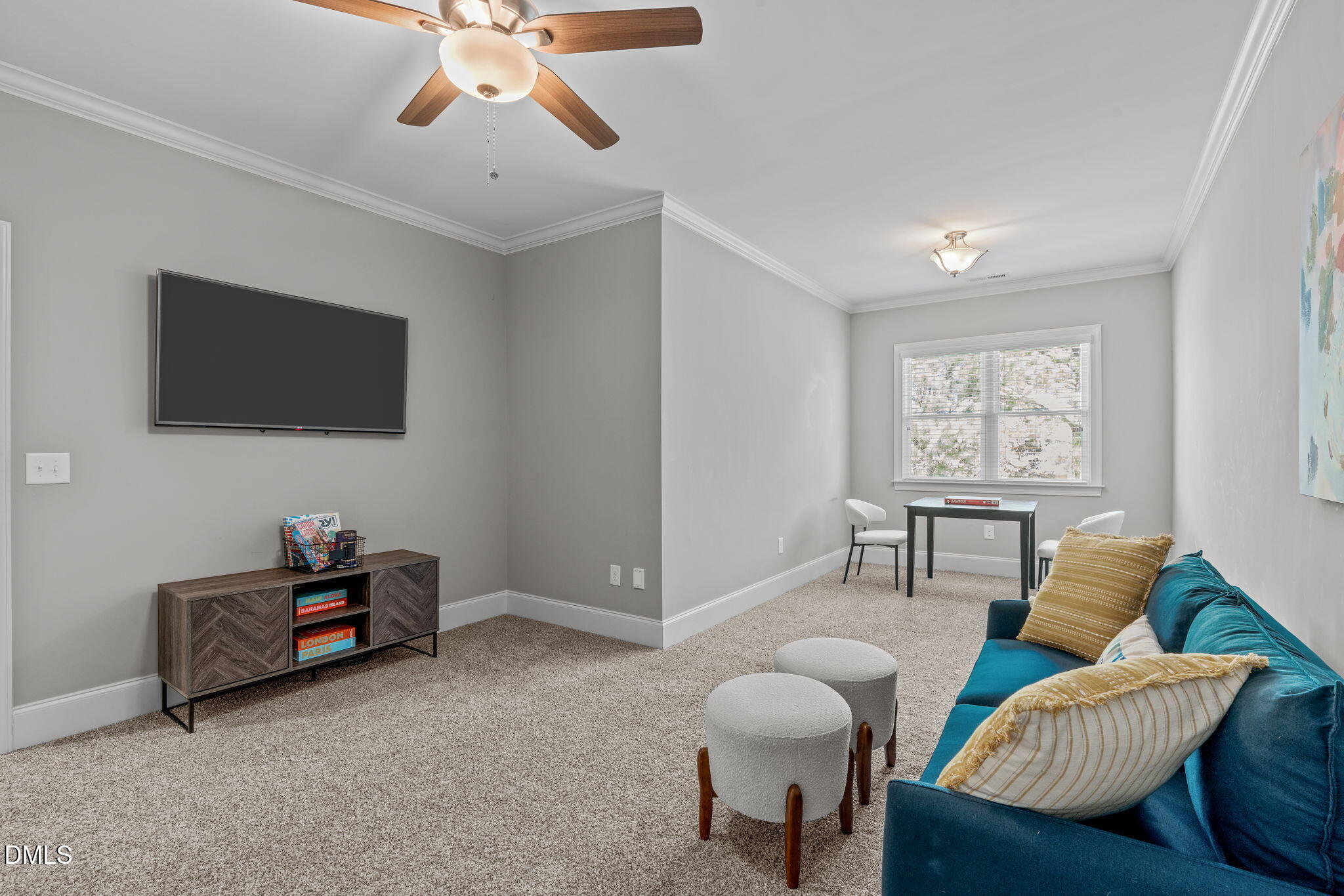261 Character Drive Rolesville, NC 27571 - Photo 45 of 61 a living room with furniture and a flat screen tv