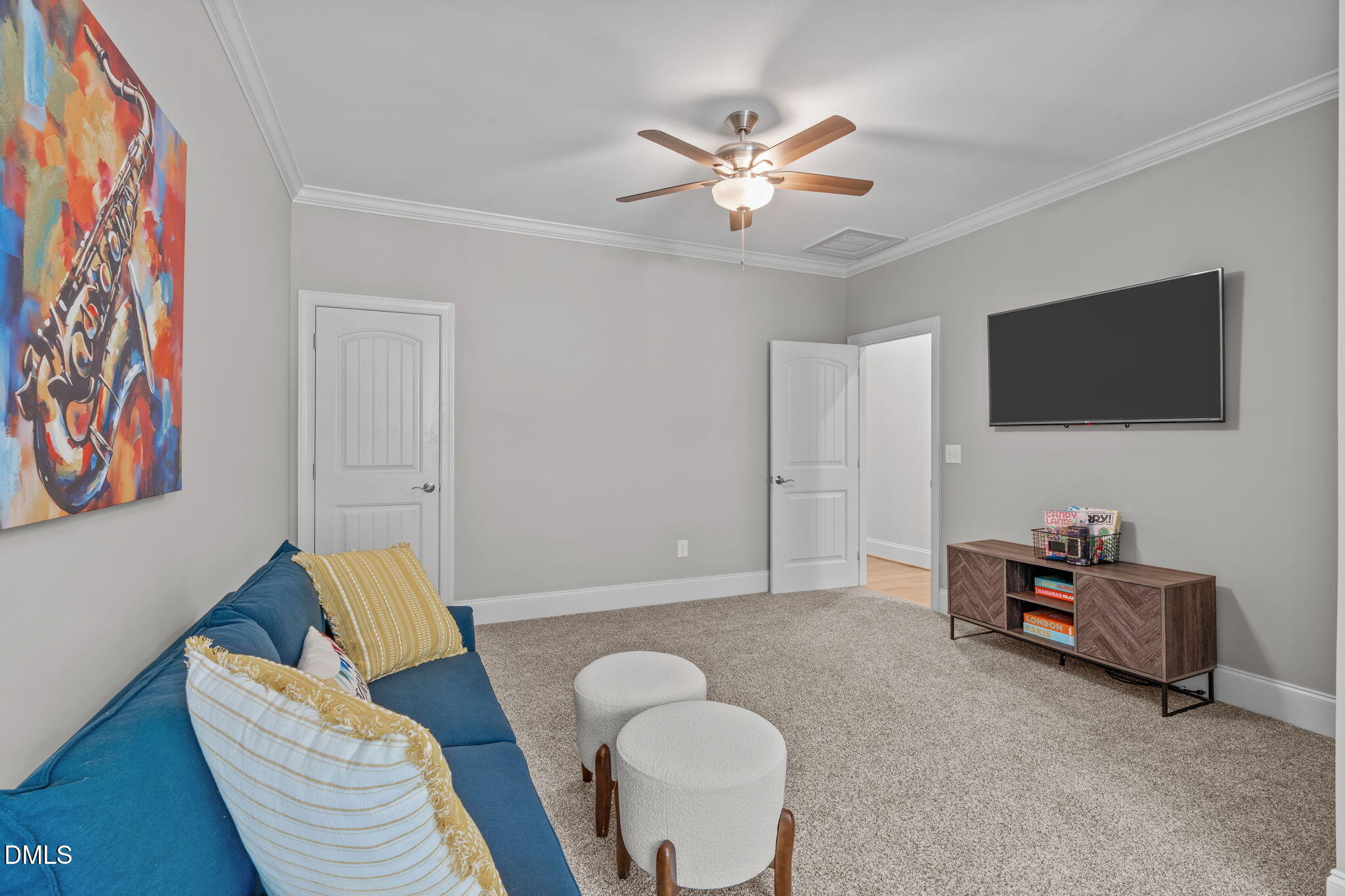261 Character Drive Rolesville, NC 27571 - Photo 46 of 61 a living room with furniture and a flat screen tv