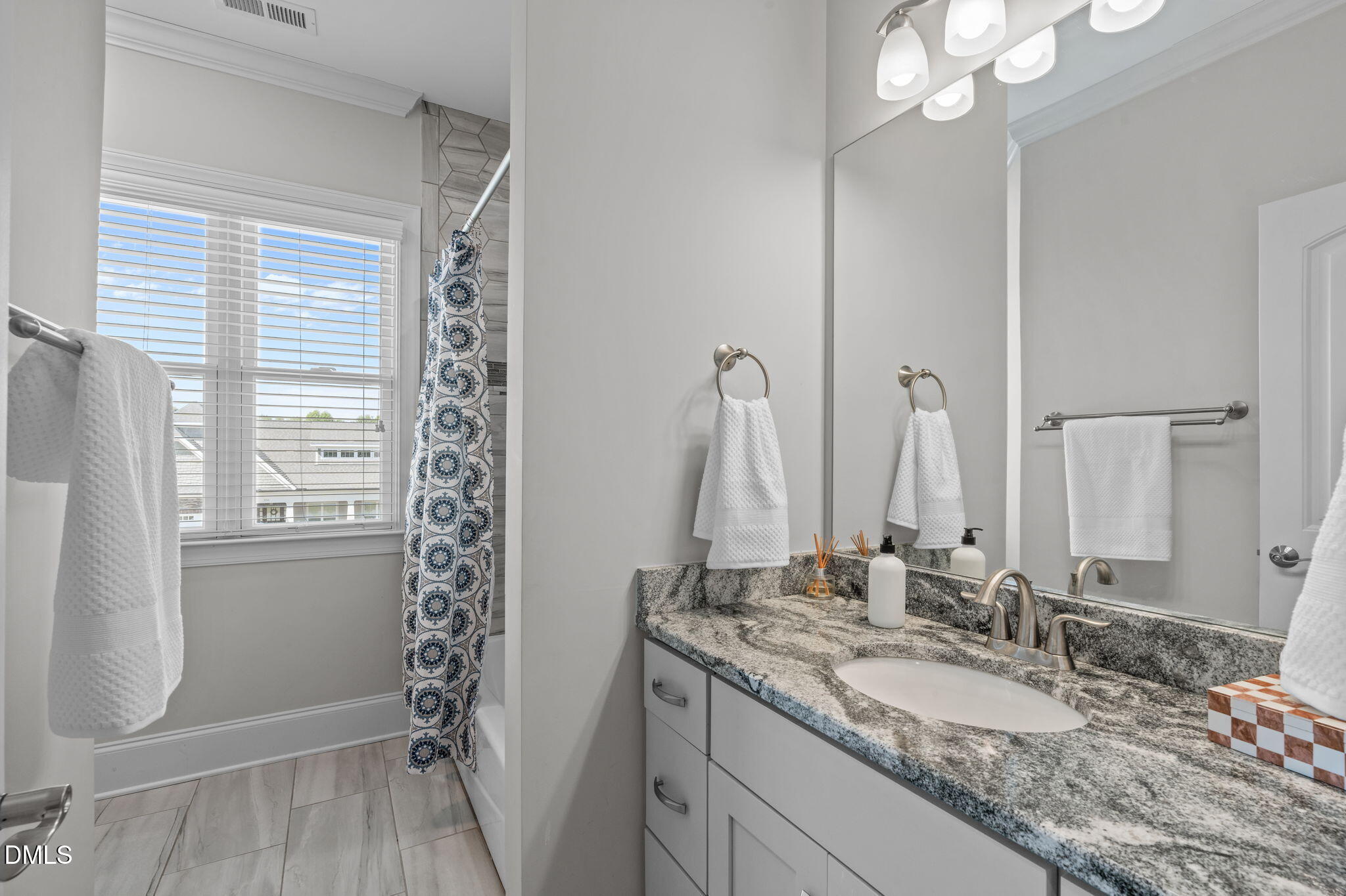 261 Character Drive Rolesville, NC 27571 - Photo 47 of 61 a bathroom with a granite countertop sink and a mirror