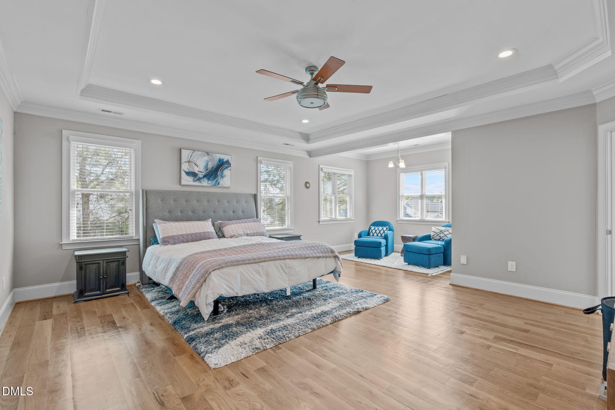 261 Character Drive Rolesville, NC 27571 - Photo 4 of 61 a bedroom with a bed and wooden floor