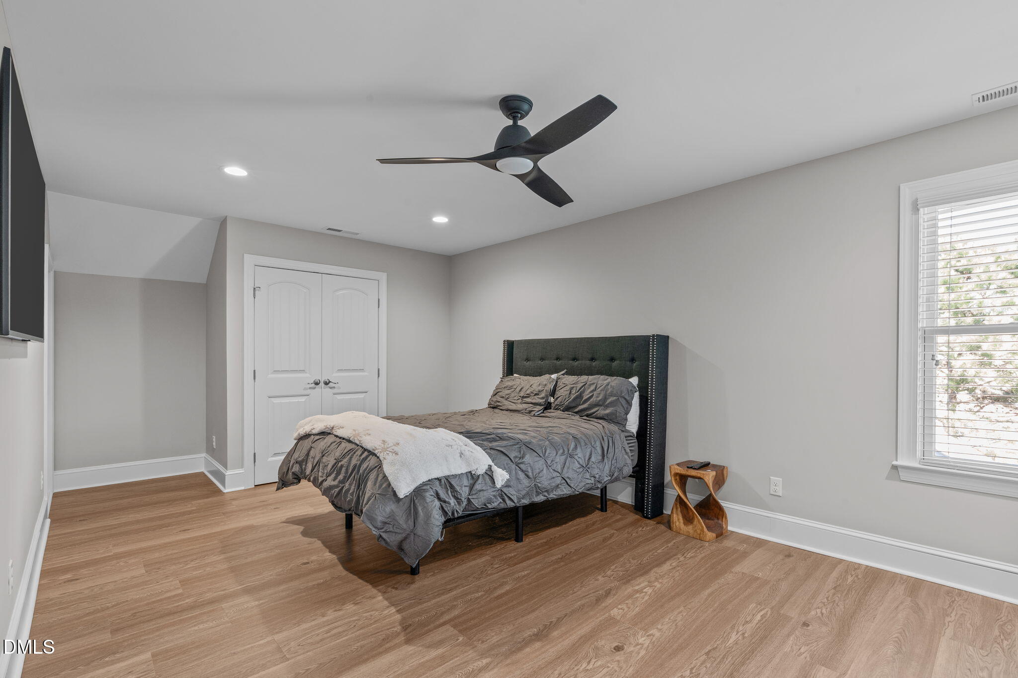 261 Character Drive Rolesville, NC 27571 - Photo 51 of 61 a bedroom with a bed and a window