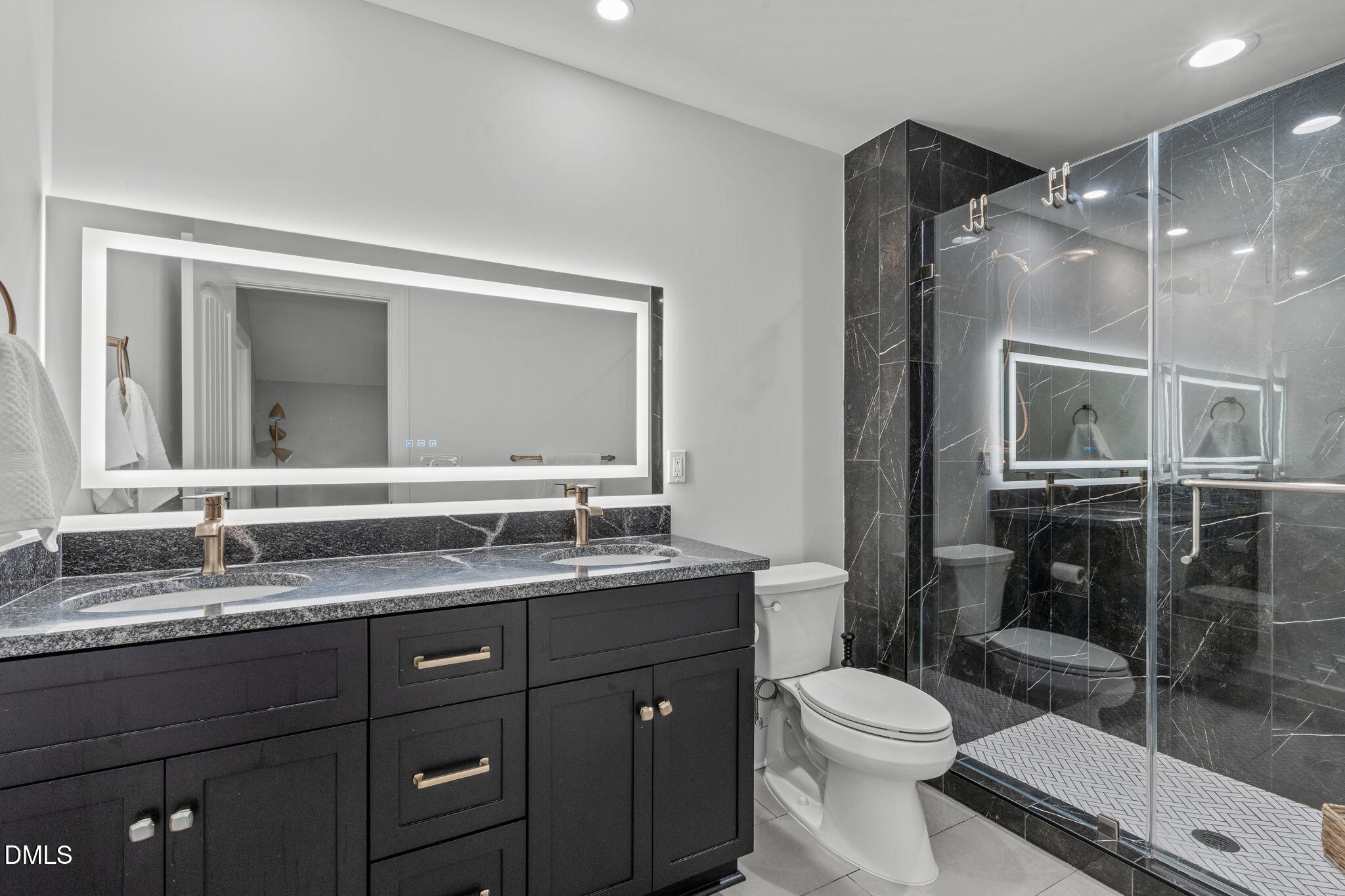 261 Character Drive Rolesville, NC 27571 - Photo 53 of 61 a bathroom with a granite countertop sink mirror vanity and toilet