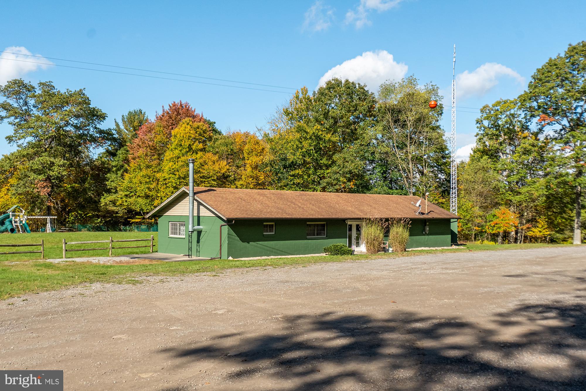 27 Gobbler Run Road Oakland, MD 21550 - Photo 8 of 24 Charming green home amid autumn hues.