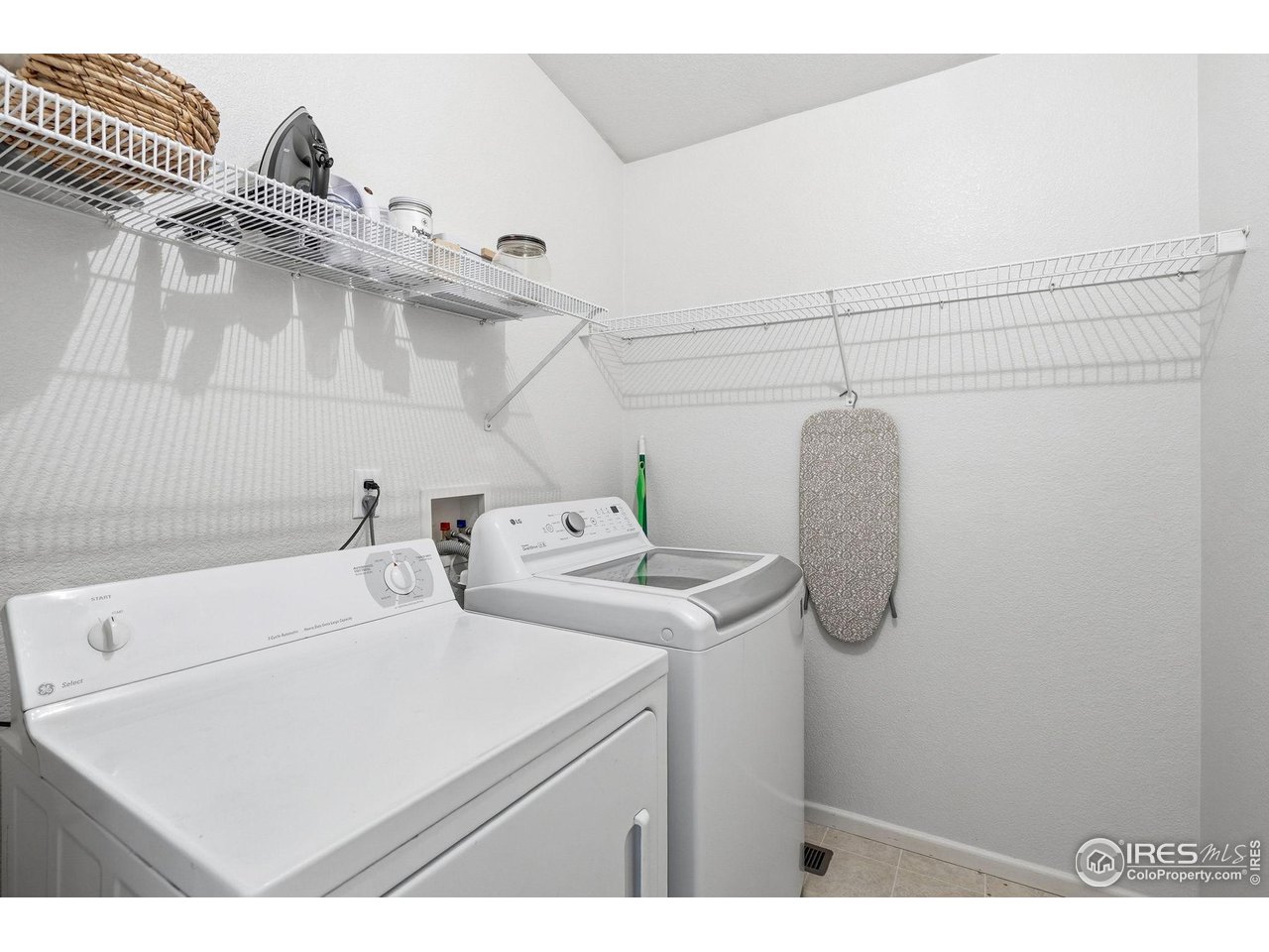 1273 Trail Ridge Road Longmont, CO 80504 - Photo 37 of 44 A large laundry room sits just behind the kitchen at the entrance from the garage.