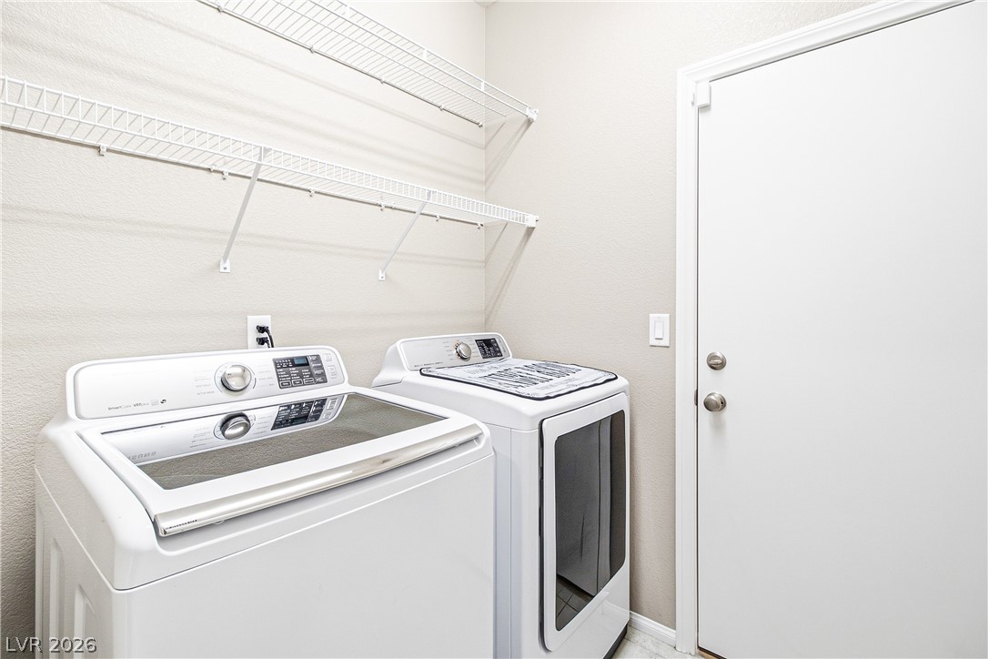 2834 Turnstone Ridge Street Henderson, NV 89044 - Photo 6 of 22 Functional utility space features overhead wire shelving and efficient appliances.