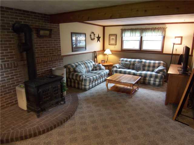 693 Yellow Mills Road Macedon, NY 14522 - Photo 6 of 16 Family Room. Lower level family room with coal/woo