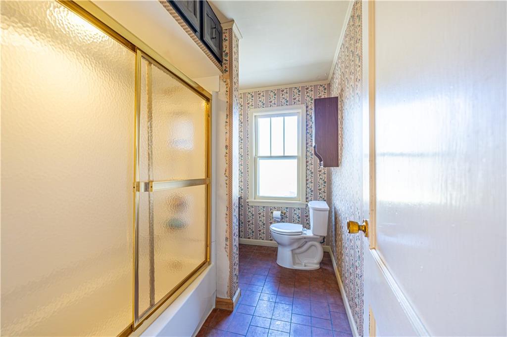 422 New Castle Road Butler, PA 16001 - Photo 17 of 27 a bathroom with a sink and a toilet