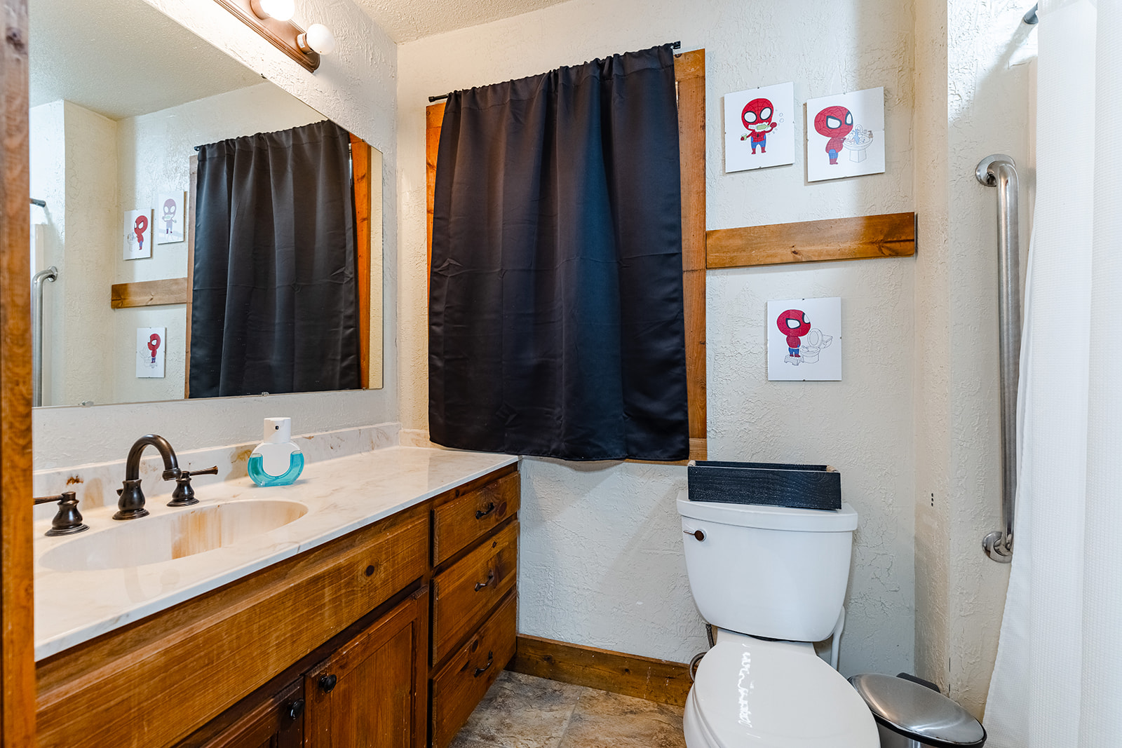 1001 Gravel Pit Road Taylor, TX 76574 - Photo 17 of 38 Full bathroom with a textured wall, vanity, and light stone finish floors