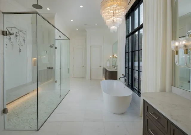 a bathroom with a bathtub and a shower