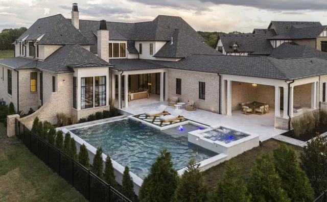 a front view of a house with yard