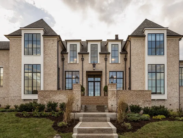 a front view of a house with a yard