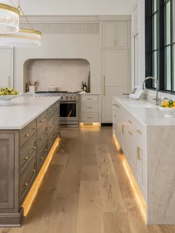a large kitchen with granite countertop a sink and cabinets