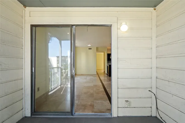 a view of a house with a small yard