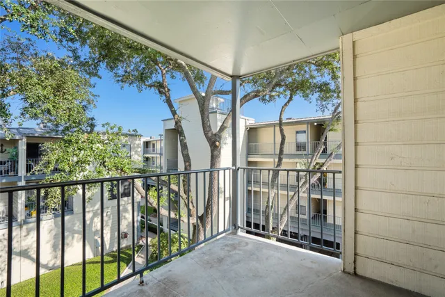 a view of balcony with a tree
