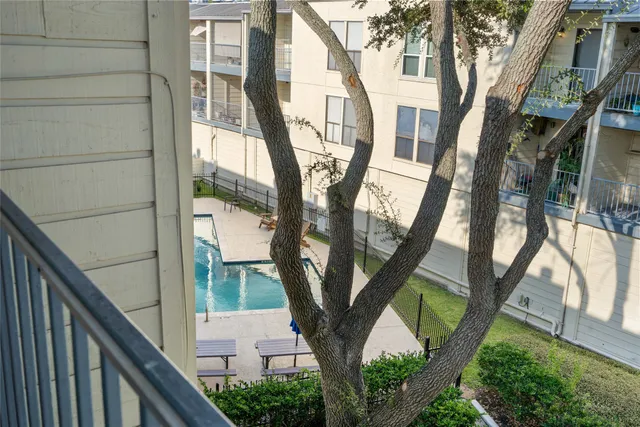 a view of a swimming pool with chairs