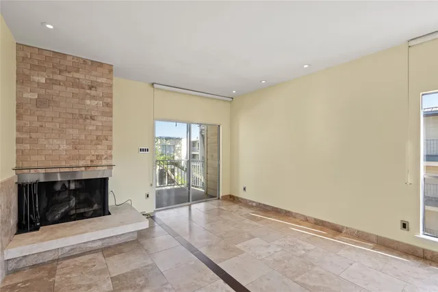 an empty room with a fireplace